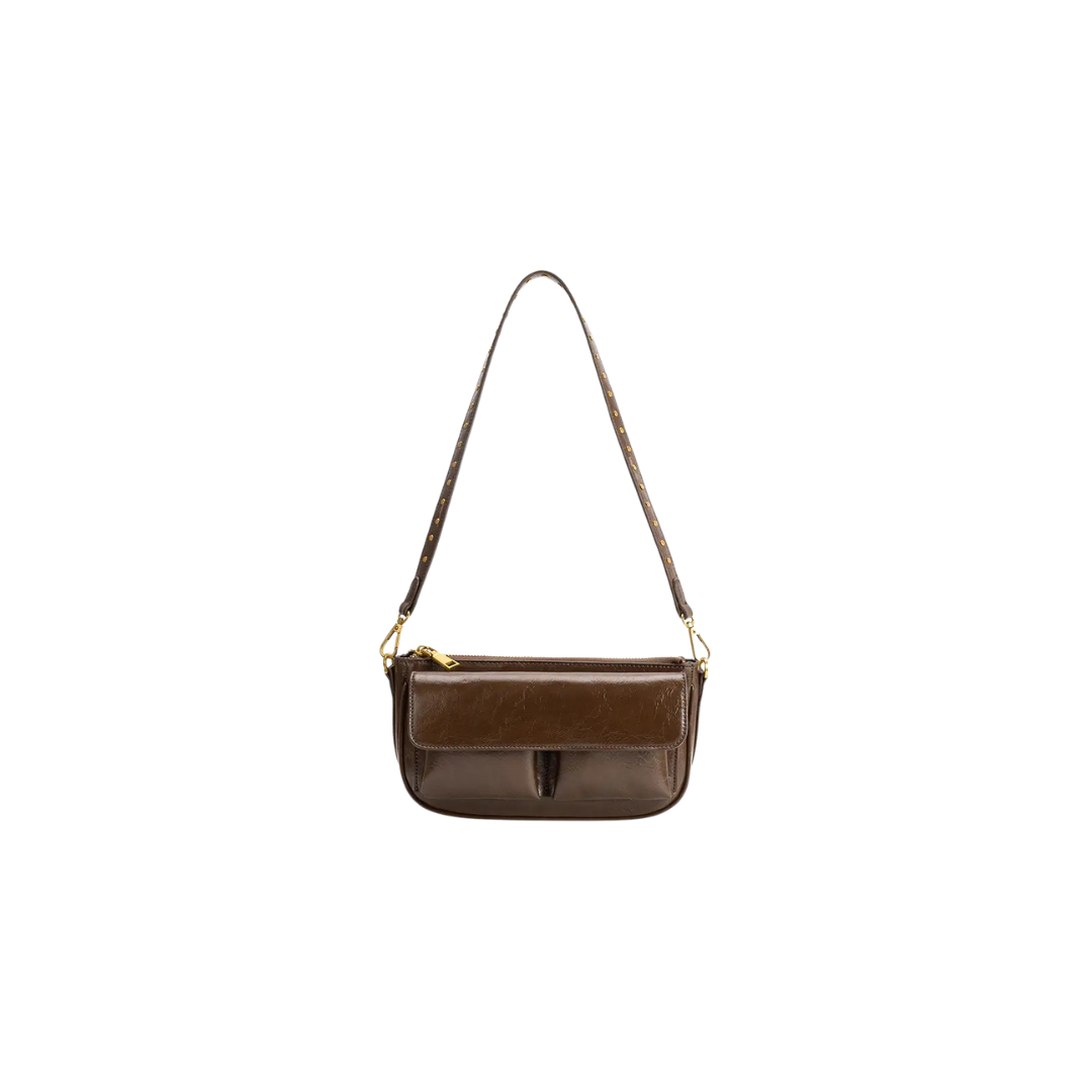 Brown leather handbag with a strap on a white background