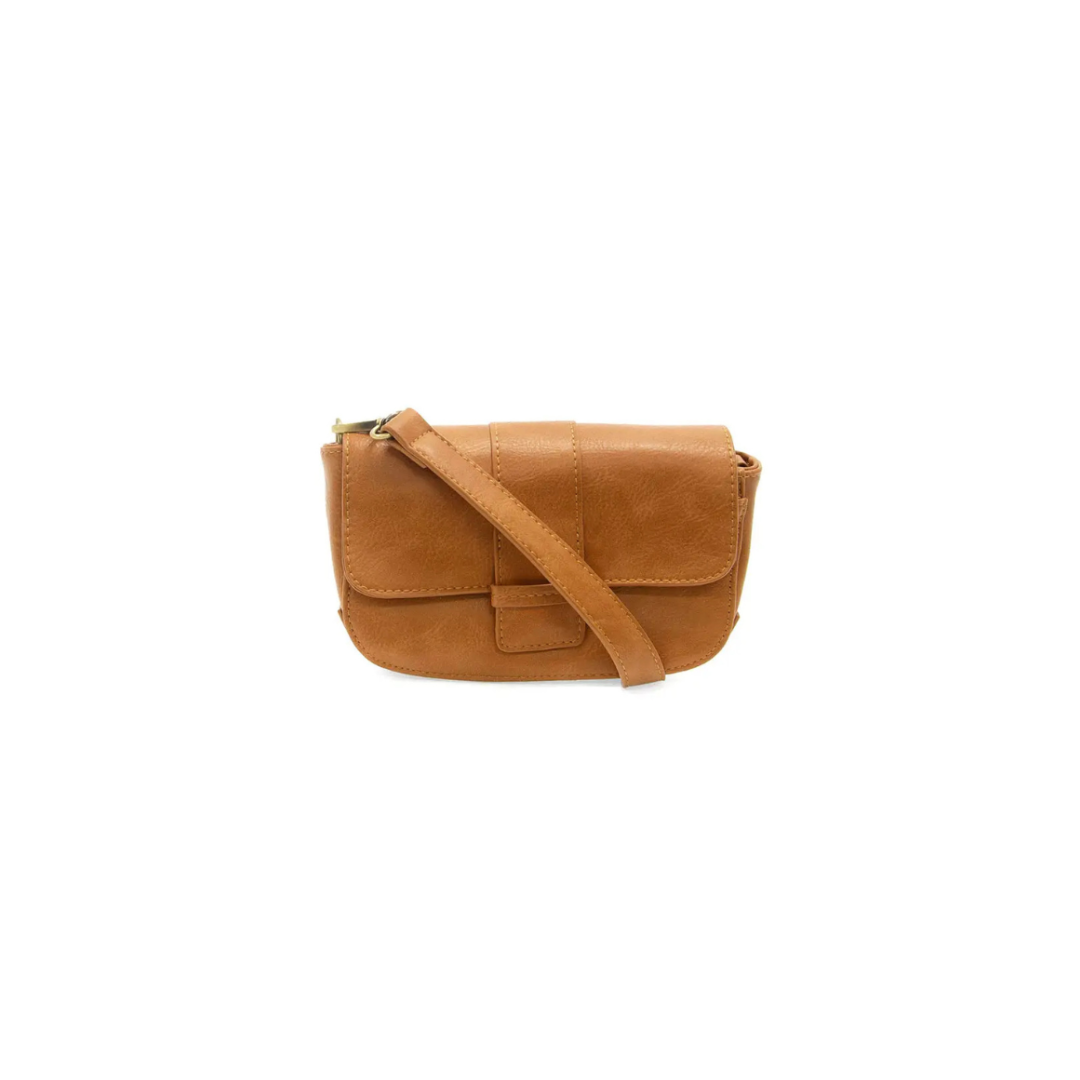 Brown leather bag with a strap on a white background