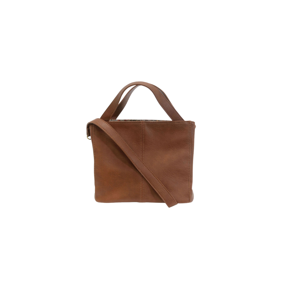 Brown leather handbag on a white background