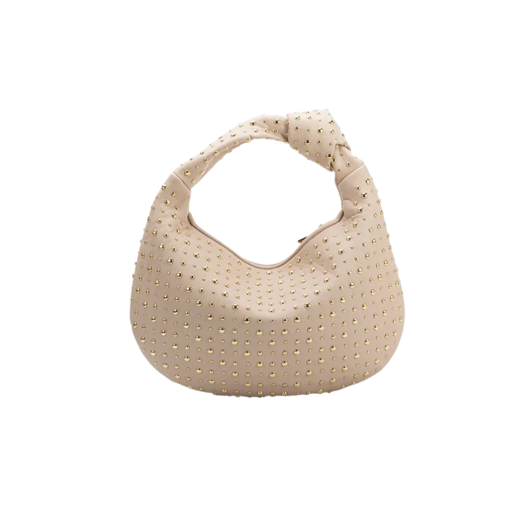 Beige handbag with textured surface on a white background