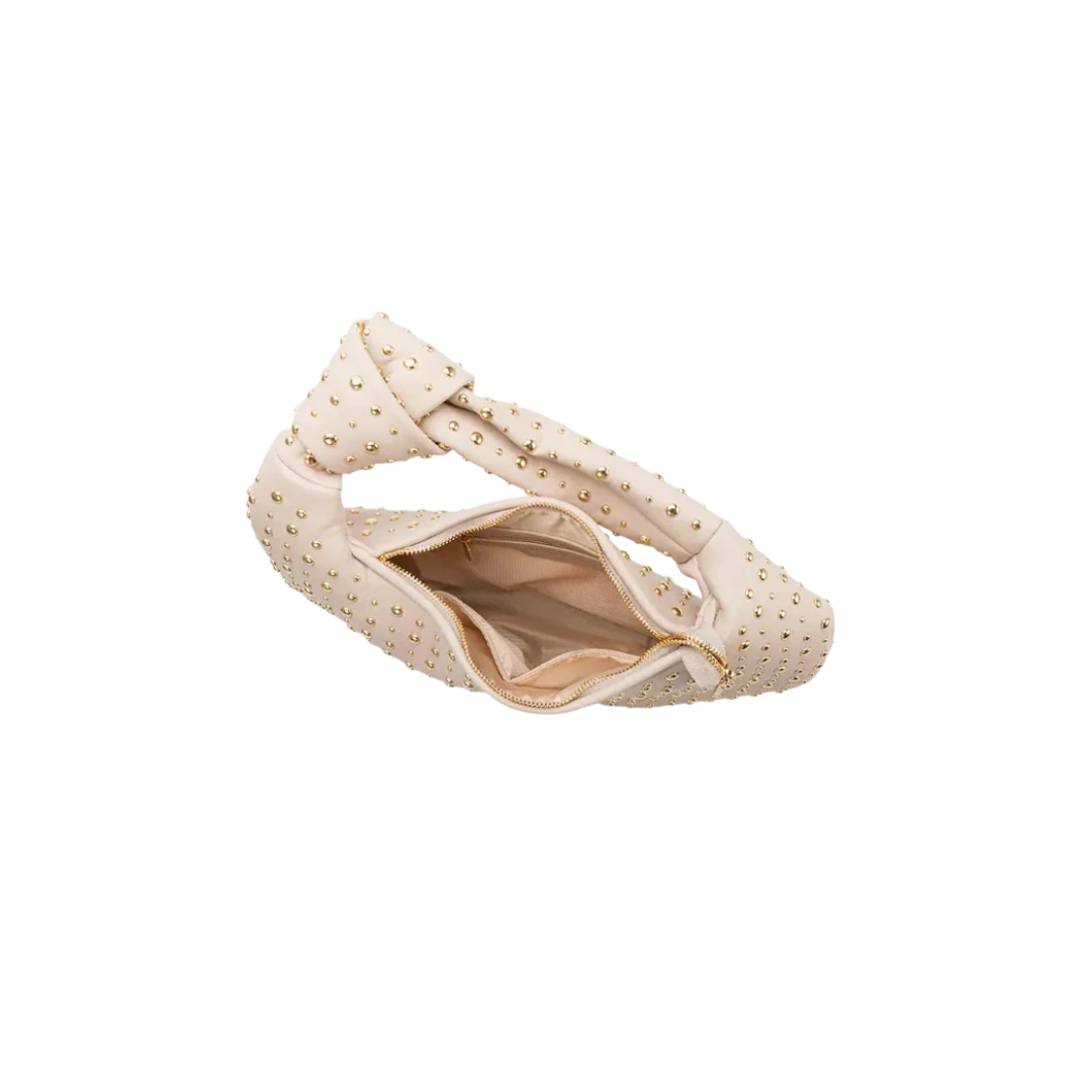 Beige sandal with polka dot pattern on a white background