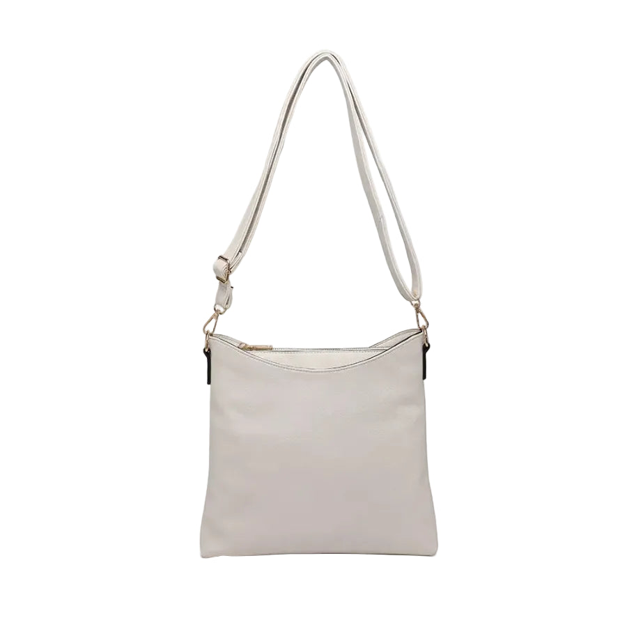 Jen & Co Emma compartment crossbody bag in cotton with multiple pockets, black exterior, and adjustable strap.