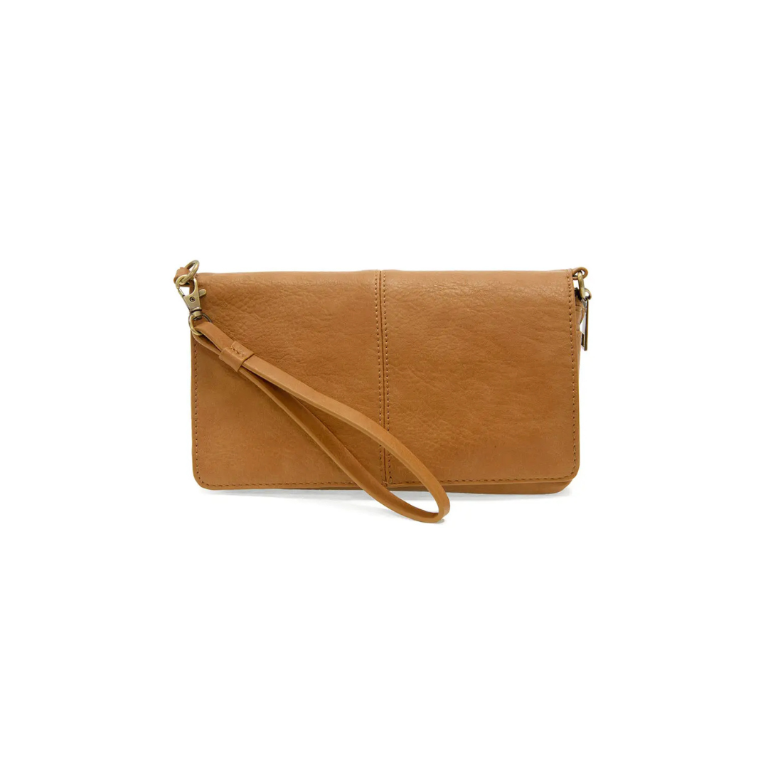 Tan leather clutch with a strap on a white background