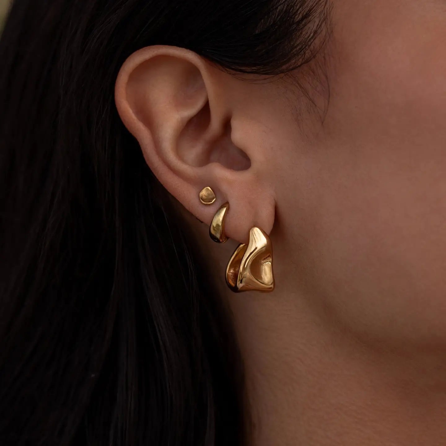 Pair of ALCO Form Studs jewelry earrings featuring sleek, minimalist metal studs for a modern accessory look.