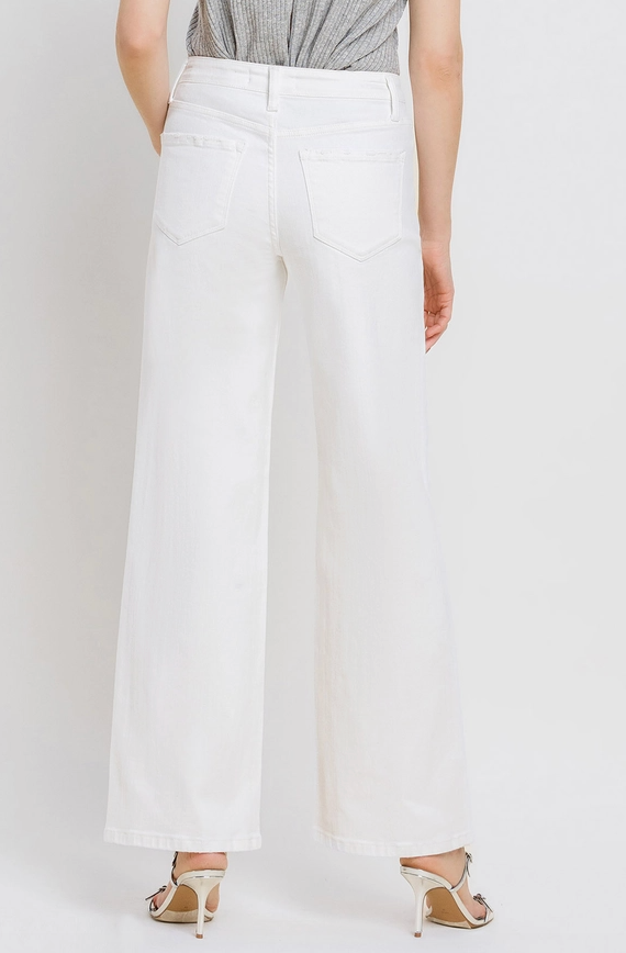 White wide-leg pants worn by a person on a plain background