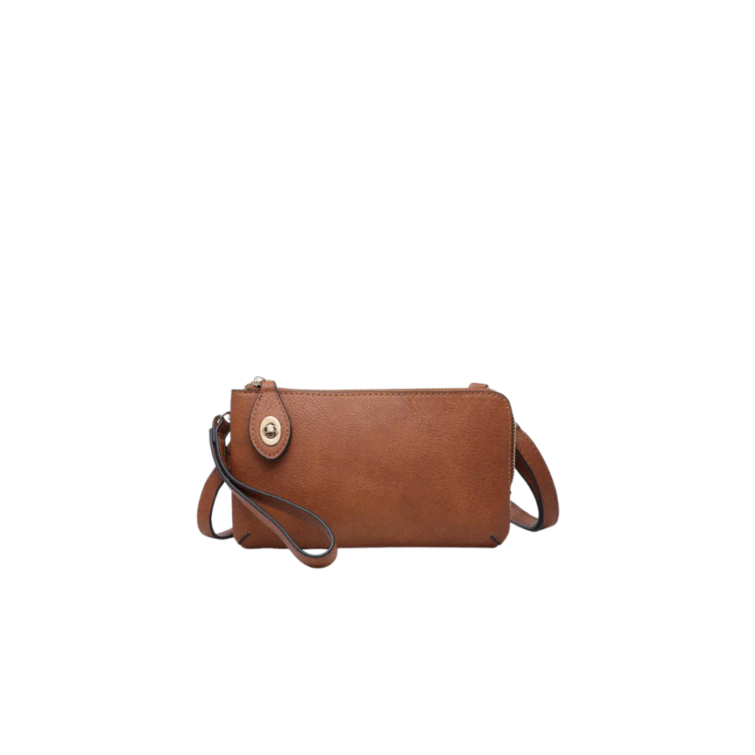 Brown leather handbag with a strap on a white background