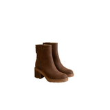 Pair of brown ankle boots on a white background