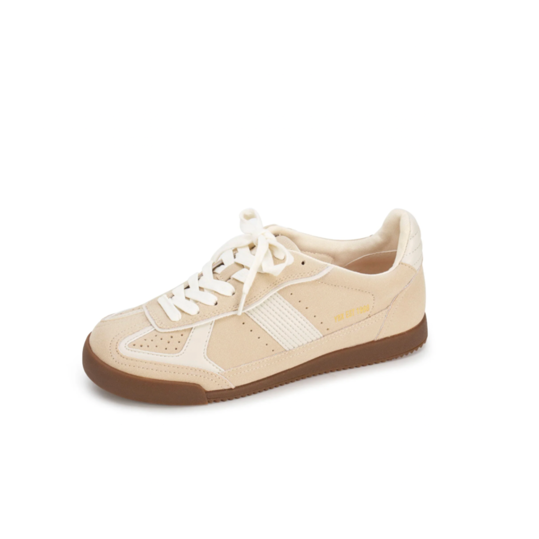 Beige sneaker with white laces on a white background