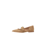 Tan flat shoe with a strap on a white background