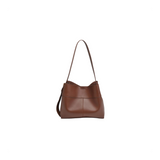 Brown leather handbag on a white background