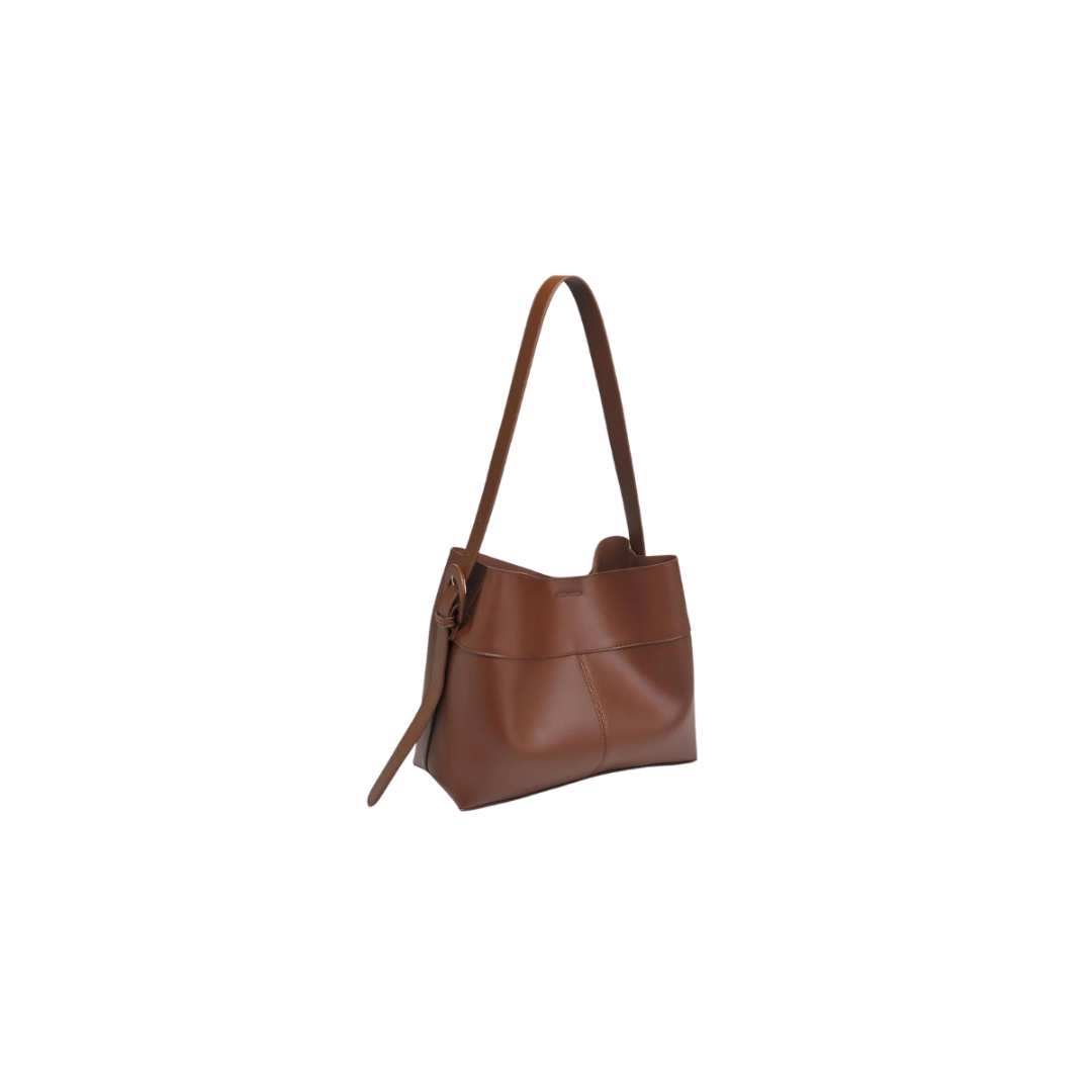Brown leather handbag on a white background