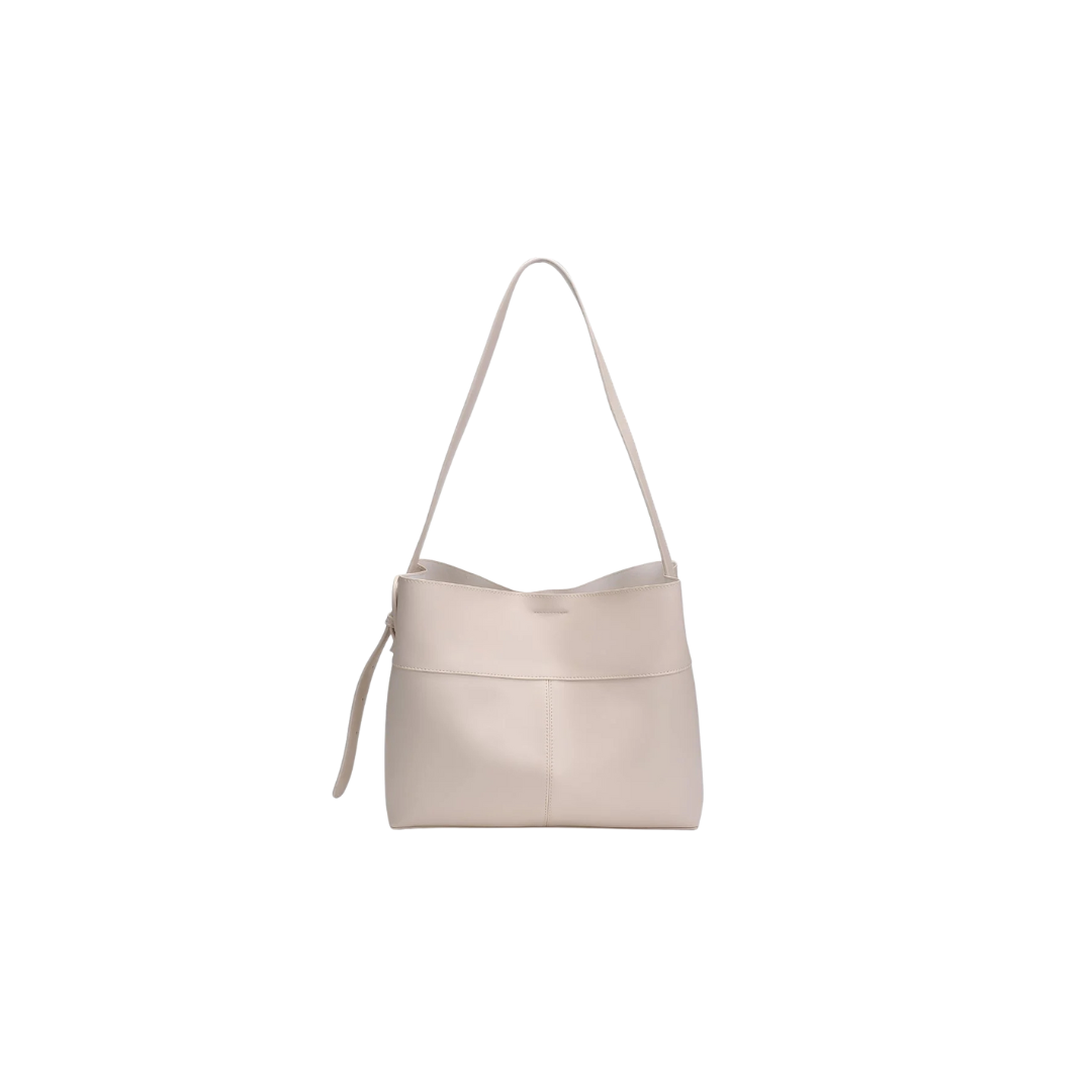 Beige handbag with a strap on a white background