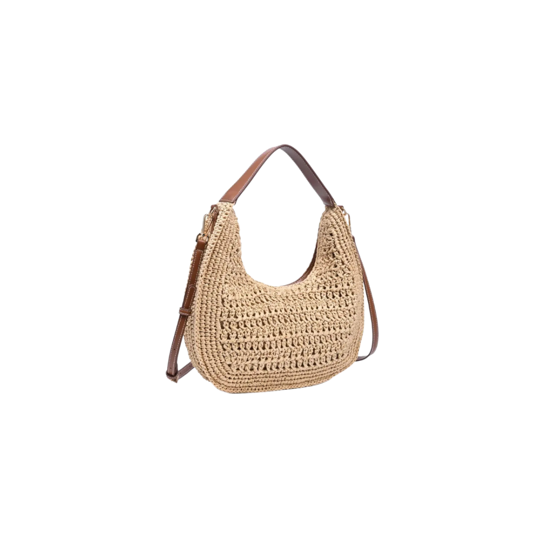 Woven handbag with brown leather strap on a white background