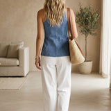 Blue denim button-up vest by Active Basic, shown layered over a tank top, casual and versatile tops for everyday wear.
