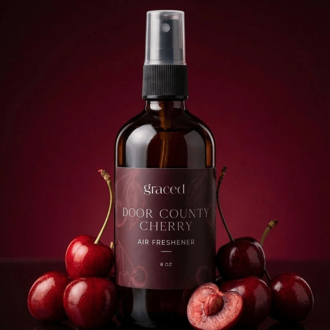 Graced Door County Cherry air freshener for home fragrance, featuring a cherry scent in a sleek container.