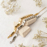 Gold intention bracelet by ALCO, a stylish jewelry accessory with a delicate design for everyday wear.