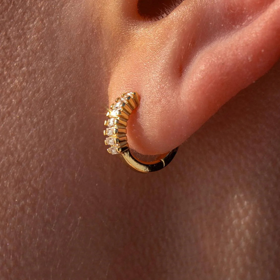 Gold Grace Huggies earrings by ALCO, small hoop jewelry with a sleek, polished finish, perfect for everyday wear.