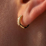Gold Grace Huggies earrings by ALCO, small hoop jewelry with a sleek, polished finish, perfect for everyday wear.