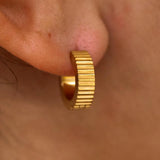 Gold Roman Huggies earrings by ALCO, stylish jewelry accessories with a classic hoop design for everyday wear.