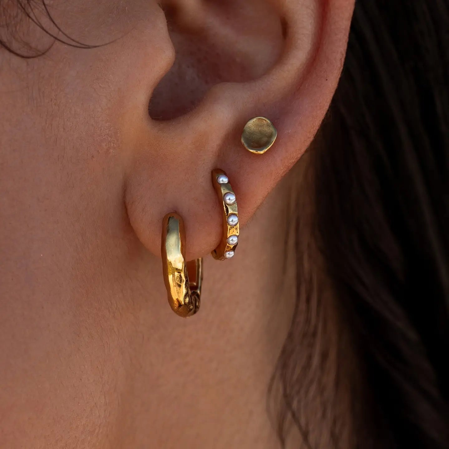 Gold Source Huggies earrings by ALCO, stylish jewelry accessory featuring classic hoop design for everyday wear.