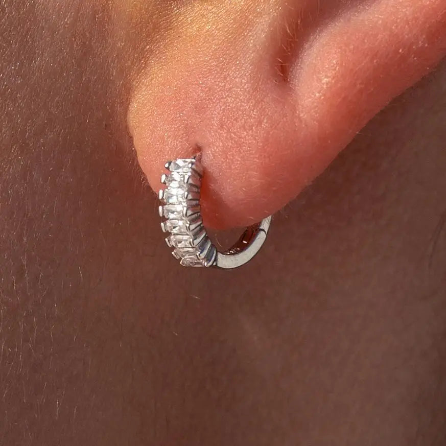 Silver Grace Huggies earrings by ALCO, small hoop jewelry with a sleek, minimalist design for everyday wear.