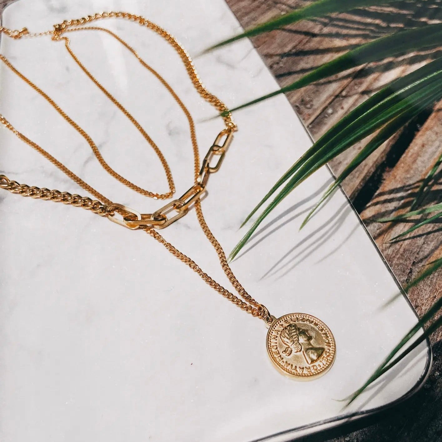 Gold 3 Little Birds Necklace by ALCO, delicate jewelry accessory featuring three bird charms on a fine chain.
