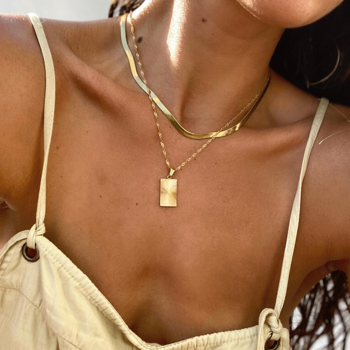 Gold 30A Necklace by ALCO, a stylish jewelry accessory with a sleek gold chain design.