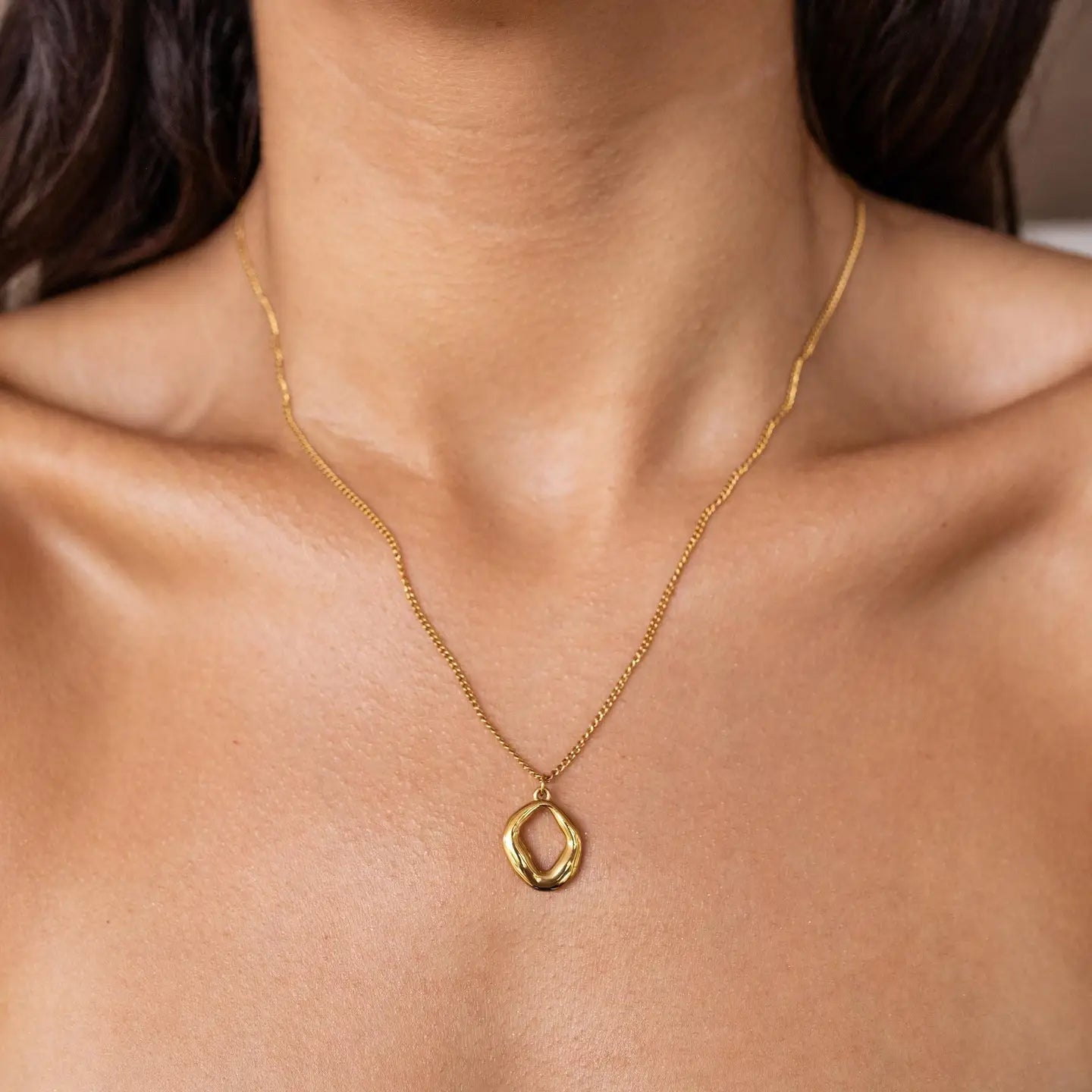 Gold Dawn Necklace by ALCO, elegant jewelry accessory featuring a delicate chain and stylish pendant.