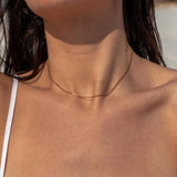 Gold Halo Necklace from ALCO, elegant jewelry accessory featuring a circular halo design on a delicate chain.