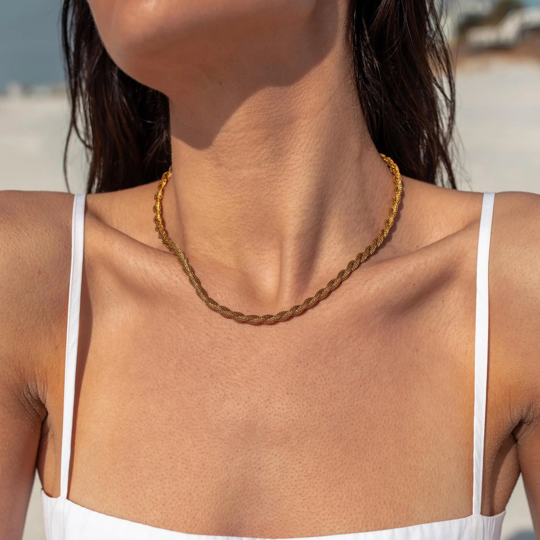 Gold Juniper Necklace by ALCO, a stylish jewelry accessory featuring a delicate chain and a unique Juniper pendant.