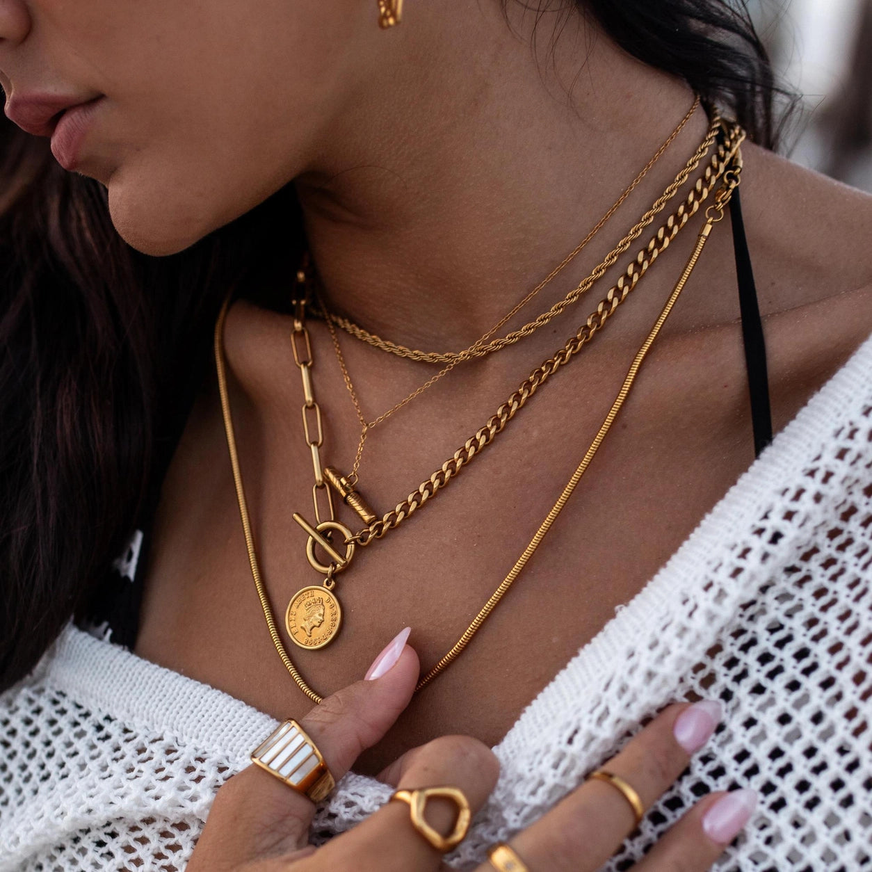 Gold Oceania Necklace by ALCO, stylish jewelry accessory featuring a delicate gold chain and intricate design.