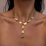 Gold Origin Necklace by ALCO featuring a sleek, minimalist chain with a modern pendant, perfect for stylish accessories.