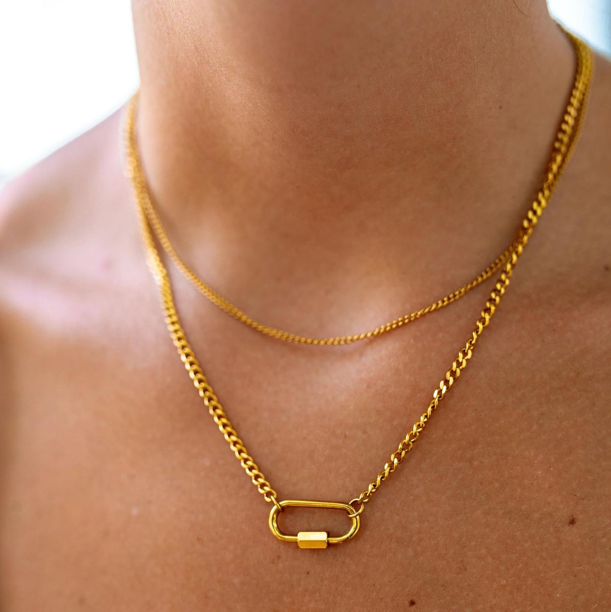 Gold Sienna Necklace by ALCO, elegant jewelry accessory featuring a polished gold pendant on a delicate chain.