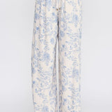 Allie Rose floral linen pants with a relaxed fit, featuring a vibrant floral pattern and lightweight, breathable fabric.
