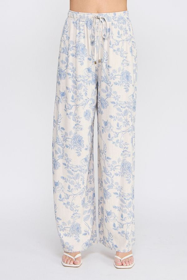 Allie Rose floral linen pants with a relaxed fit, featuring a vibrant floral pattern and lightweight, breathable fabric.