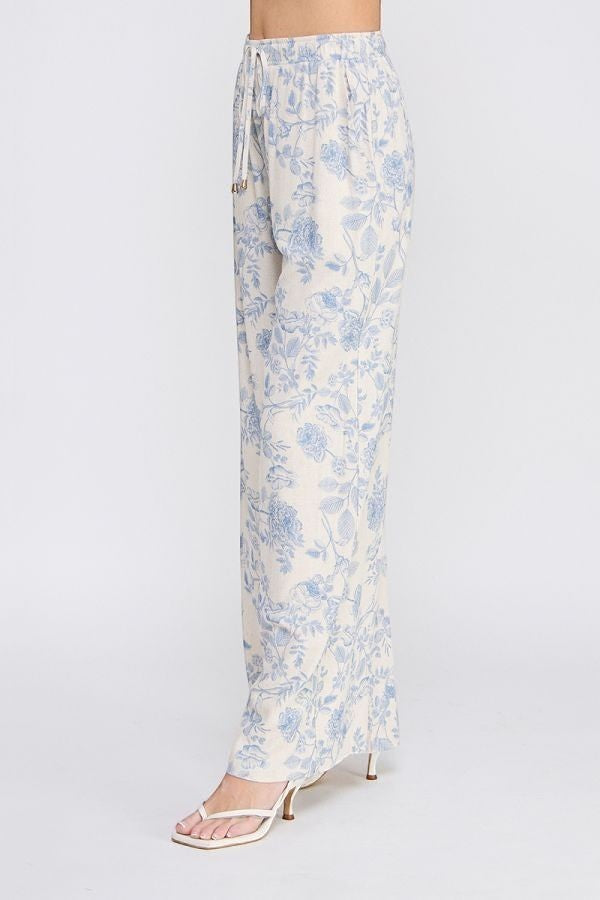 Allie Rose floral linen pants in blue with small blossom print, casual bottoms with relaxed fit and lightweight fabric.