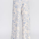 Allie Rose floral linen pants with a relaxed fit and vibrant floral pattern, styled as casual bottoms.