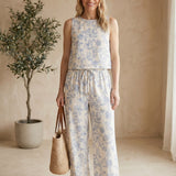 Light blue floral linen pants by Allie Rose, featuring a relaxed fit and small blossom pattern, perfect for casual wear.