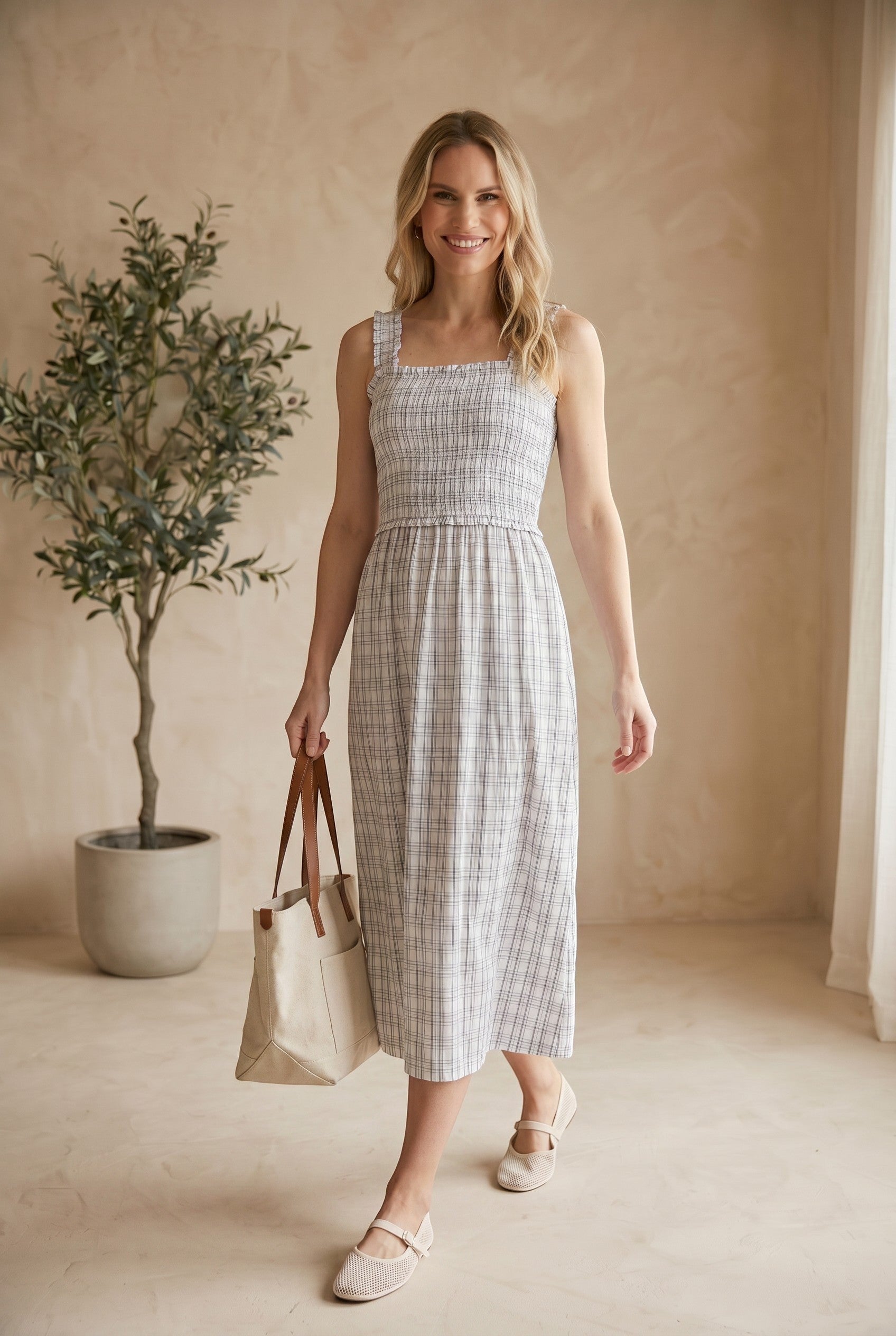 Blue plaid print smocked midi dress by Allie Rose featuring a fitted bodice and flowy skirt, perfect for casual or dressy occasions.