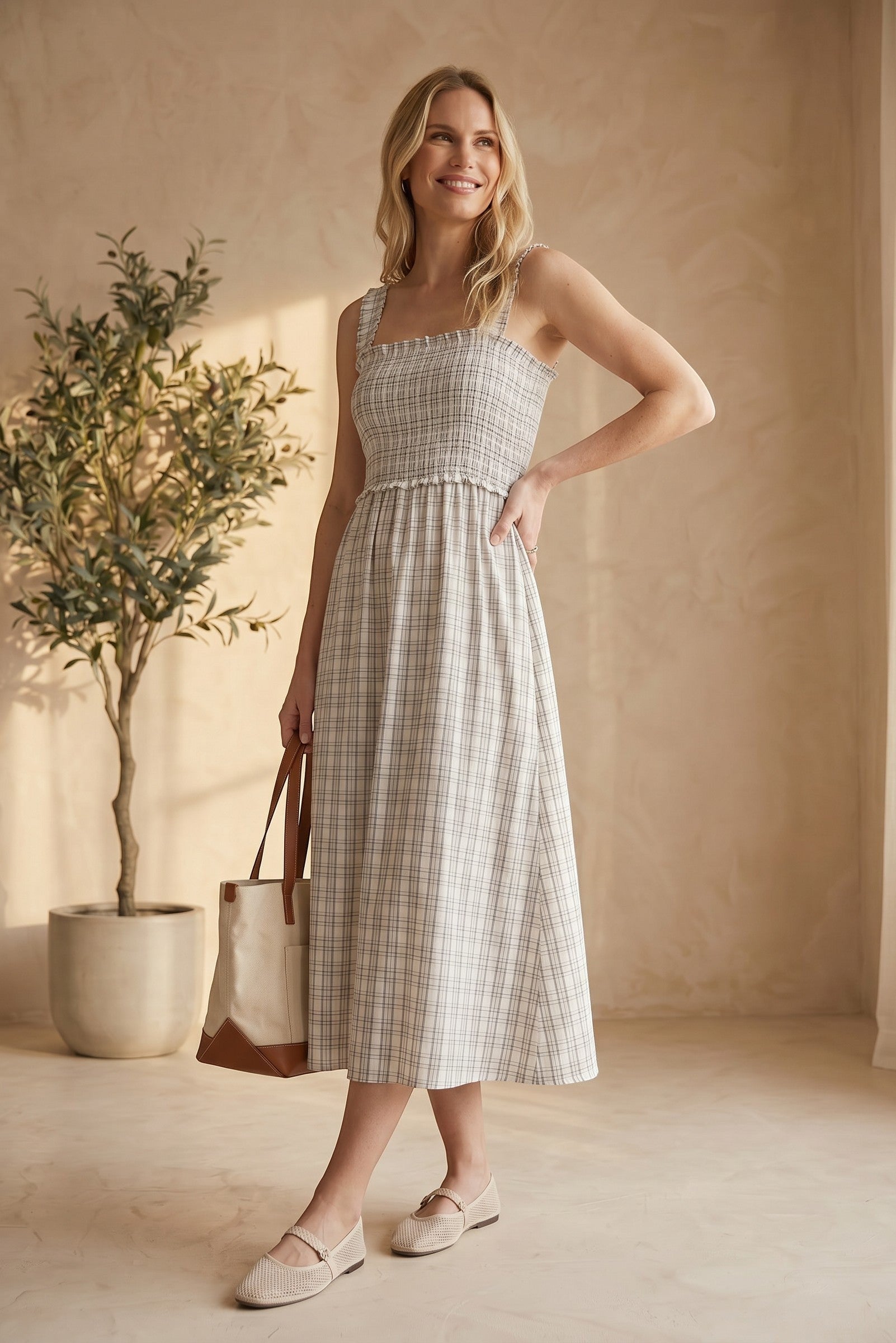 Blue plaid print smocked midi dress by Allie Rose featuring a fitted bodice and flowy skirt, suitable for casual or semi-formal wear.