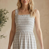 Allie Rose plaid print smocked midi dress in blue with a fitted bodice and flowing skirt, perfect for casual or semi-formal wear.