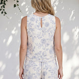 Blue floral linen top by Allie Rose featuring small blossom print, lightweight and casual for everyday wear.