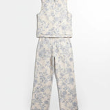 Cream and blue floral linen top by Allie Rose, featuring a lightweight, breathable fabric and a relaxed fit for casual wear.