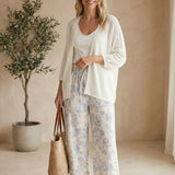 Cream Be Cool Dolman Open Cardigan made of soft knit fabric, displayed on a hanger with a relaxed fit and open front design.