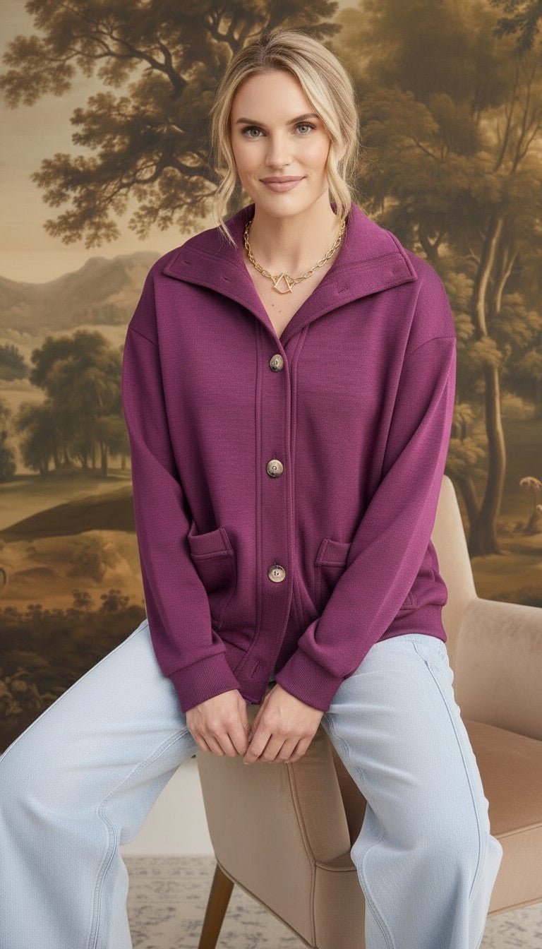 graced wine mock neck button down cardigan with front pockets worn by a blonde model in a relaxed fit
