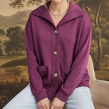 graced wine mock neck button down cardigan with front pockets worn by a blonde model in a relaxed fit