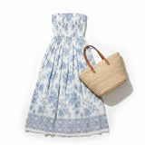 Floral smocked strapless midi dress by By Together, featuring a cotton-rayon fabric with a fitted bodice and flowing skirt.