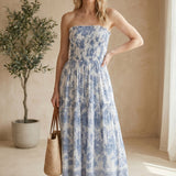 Floral smocked strapless midi dress by By Together displayed on a virtual model, showcasing a fitted waist and flowing skirt.