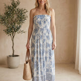 Floral smocked strapless midi dress by By Together displayed on a virtual model, showcasing a fitted bodice and flowing skirt.