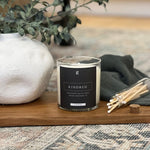Graced Kindred 9oz candle for home fragrance, featuring a sleek design and warm glow perfect for cozy ambiance.